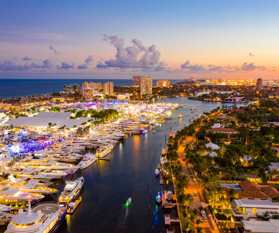 Aerial view of a city marina lit up at night