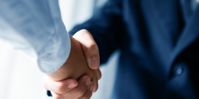 Untitled-design-20 Two people shaking hands